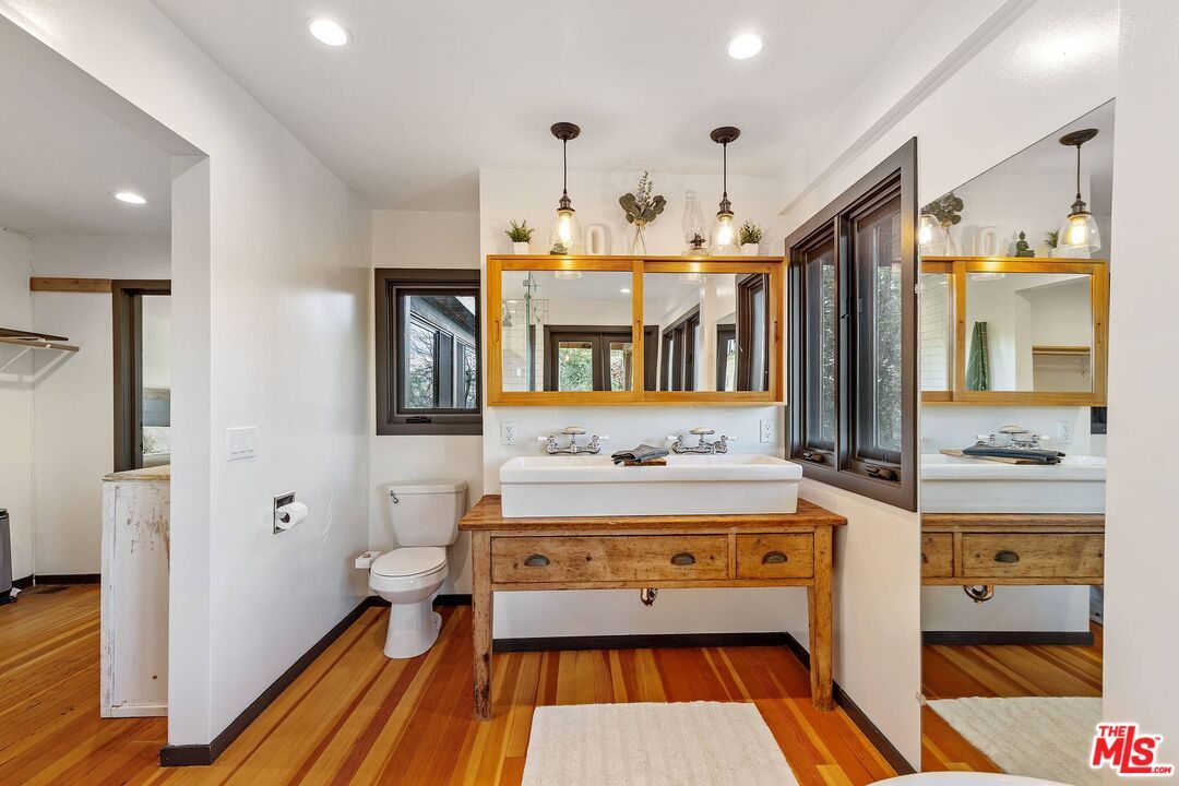 Bathroom, Dual Sink Vanities, Interior, Pendant Lights, Recessed Lighting, Wood Texture Flooring