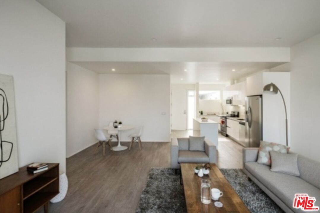 Dining room, Interior, Kitchen, Living room, Recessed Lighting, Stainless Steel Appliances, Wood Texture Flooring