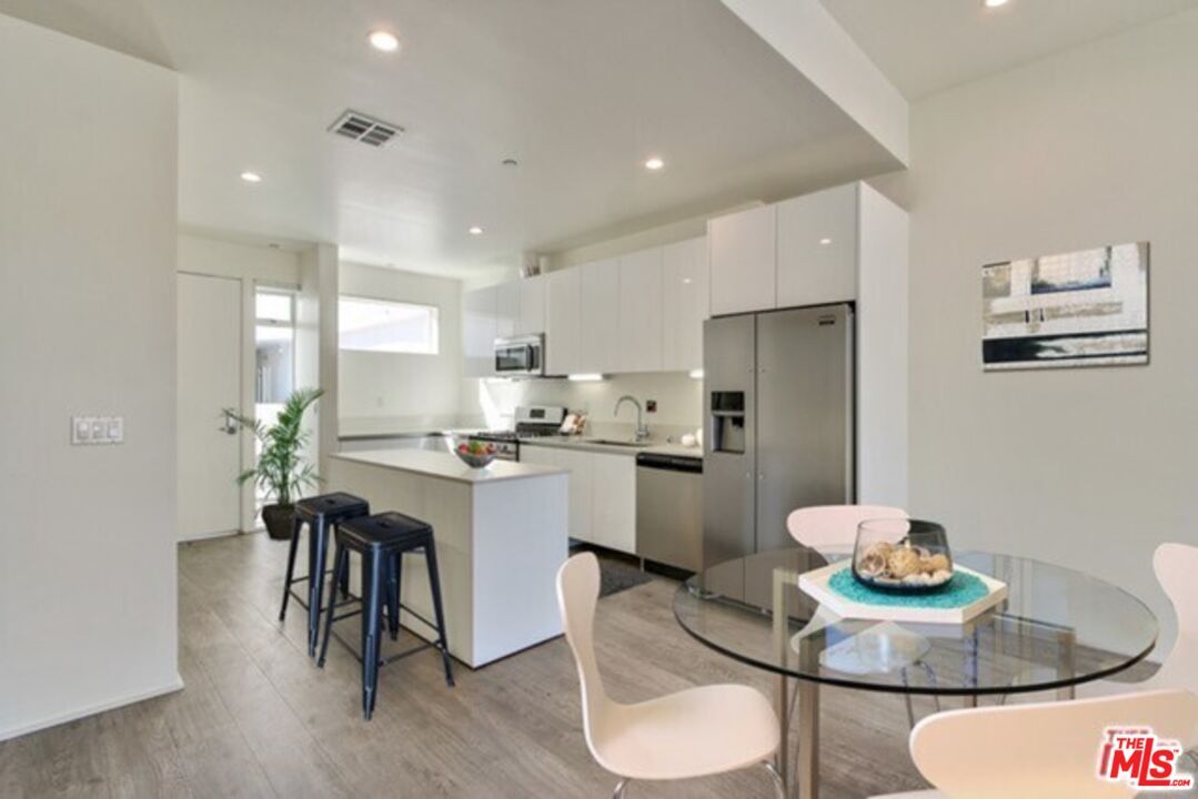 Dining room, Interior, Kitchen, Recessed Lighting, Stainless Steel Appliances, Wood Texture Flooring