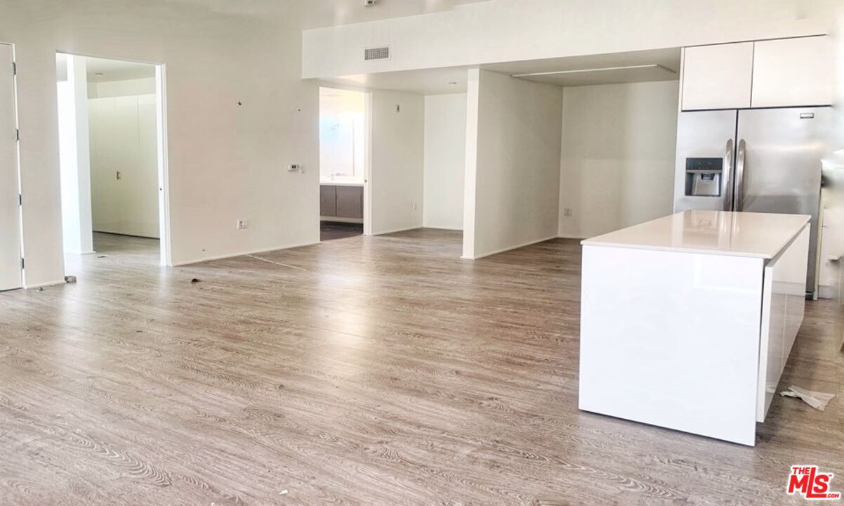 Empty room, Interior, Kitchen, Stainless Steel Appliances, Wood Texture Flooring
