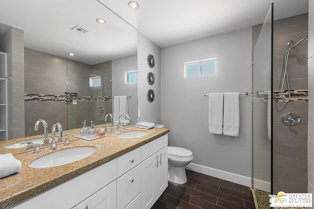 Bathroom, Dual Sink Vanities, Glass Shower, Interior, Recessed Lighting, Wood Texture Flooring