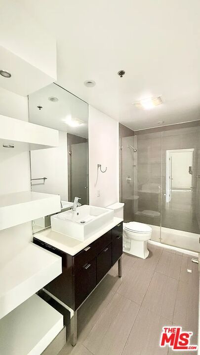 Bathroom, Dual Sink Vanities, Glass Shower, Interior, Recessed Lighting, Wood Texture Flooring