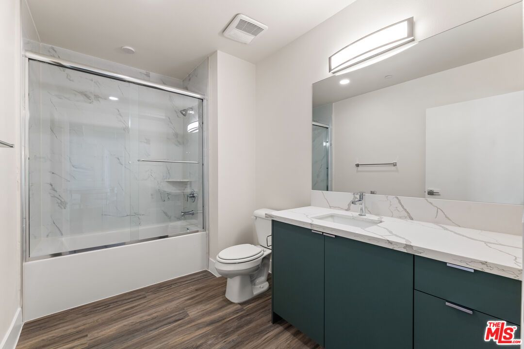 Bathroom, Glass Shower, Interior, Marble Walls, Recessed Lighting, Wood Texture Flooring