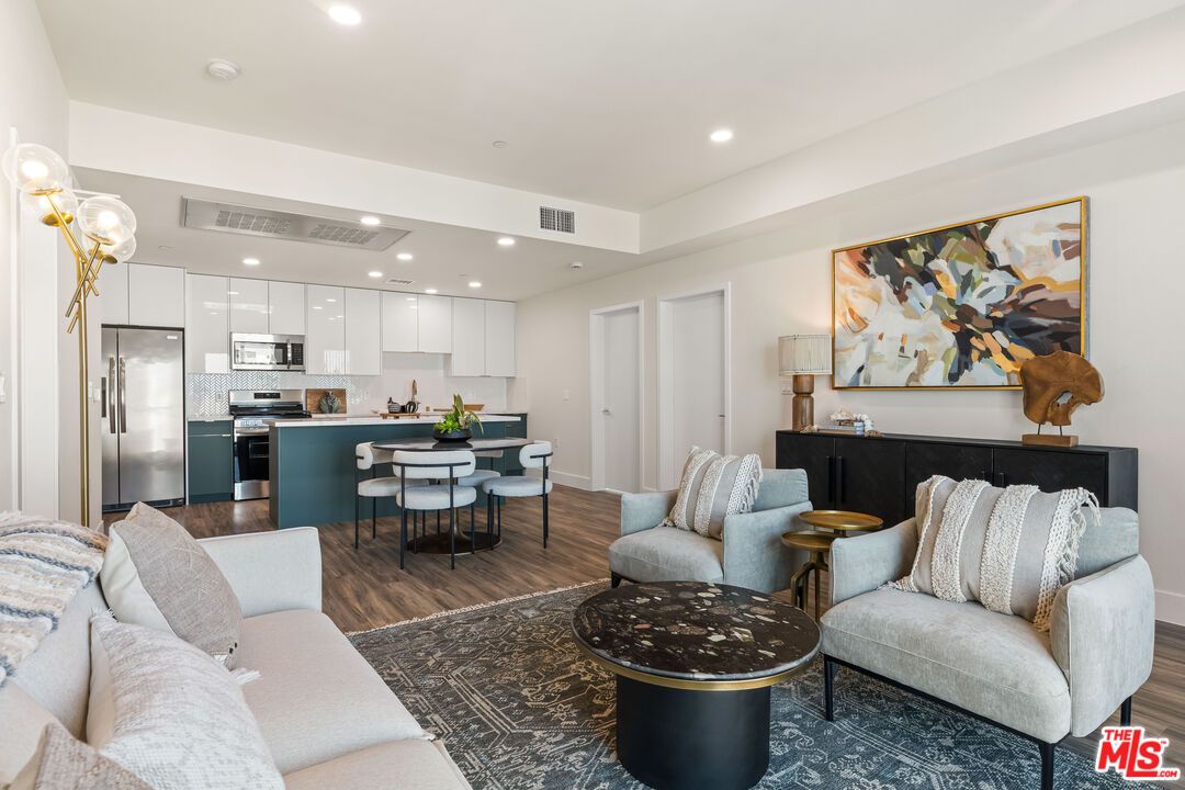 Dining room, Interior, Kitchen, Living room, Recessed Lighting, Stainless Steel Appliances, Wood Texture Flooring