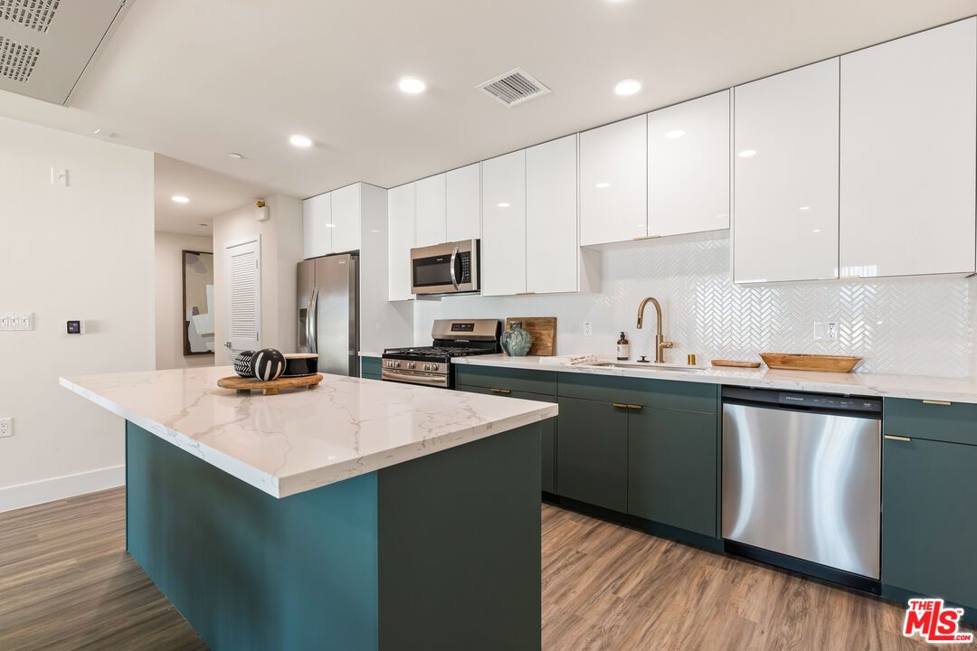 Interior, Kitchen, Recessed Lighting, Stainless Steel Appliances, Wood Texture Flooring