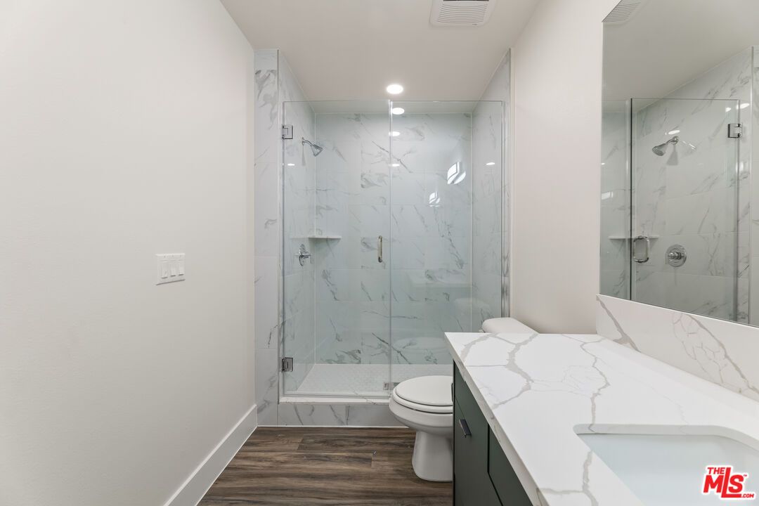Bathroom, Glass Shower, Interior, Marble Walls, Recessed Lighting, Wood Texture Flooring