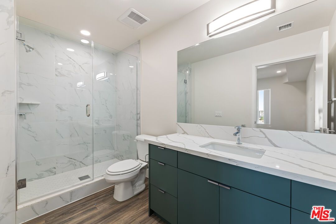 Bathroom, Glass Shower, Interior, Marble Walls, Recessed Lighting, Wood Texture Flooring