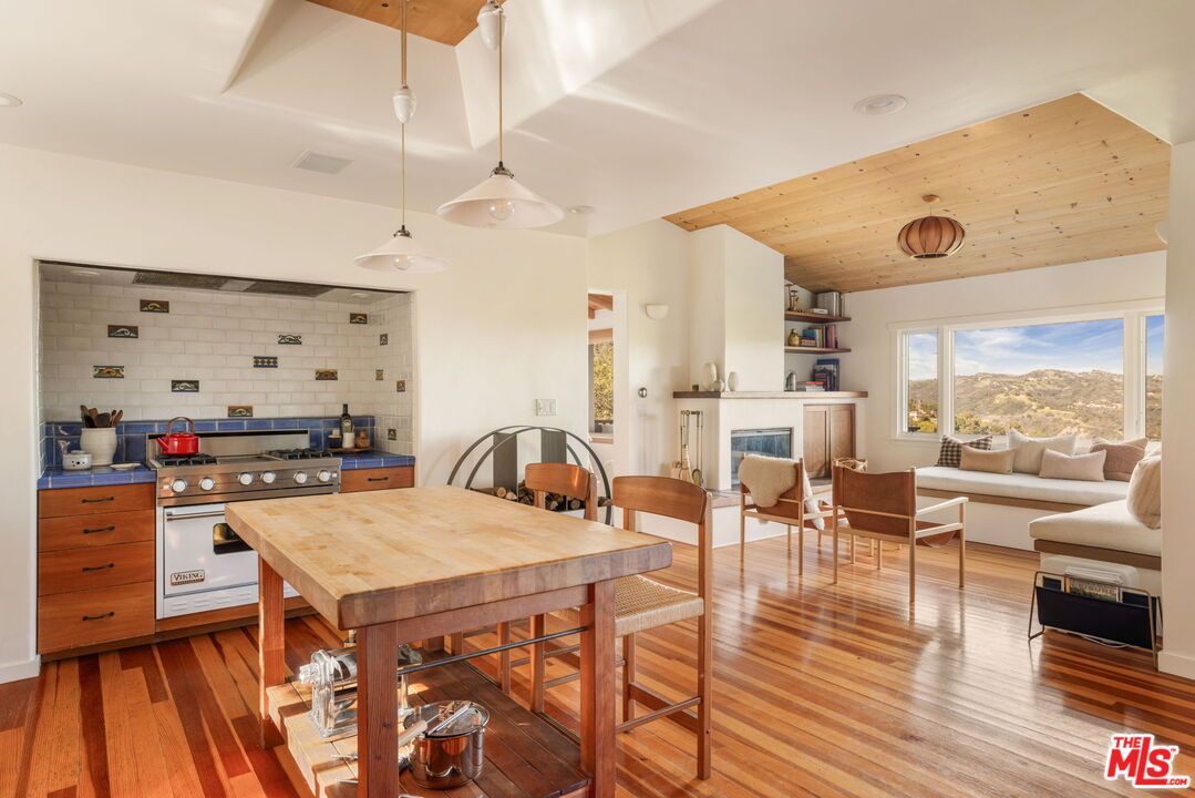 Dining room, Fireplace, Interior, Kitchen, Living room, Pendant Lights, Recessed Lighting, Stone Walls, Wooden Ceilings, Wood Texture Flooring