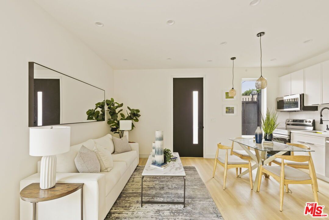 Dining room, Interior, Kitchen, Living room, Pendant Lights, Recessed Lighting, Stainless Steel Appliances, Wood Texture Flooring