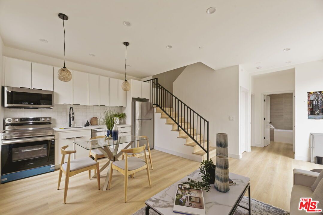 Dining room, Interior, Kitchen, Pendant Lights, Recessed Lighting, Stainless Steel Appliances, Wood Texture Flooring