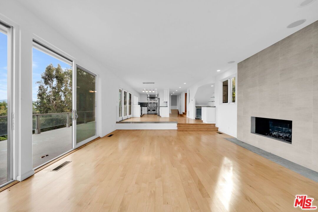 Empty room, Fireplace, Interior, Kitchen, Pendant Lights, Recessed Lighting, Wood Texture Flooring
