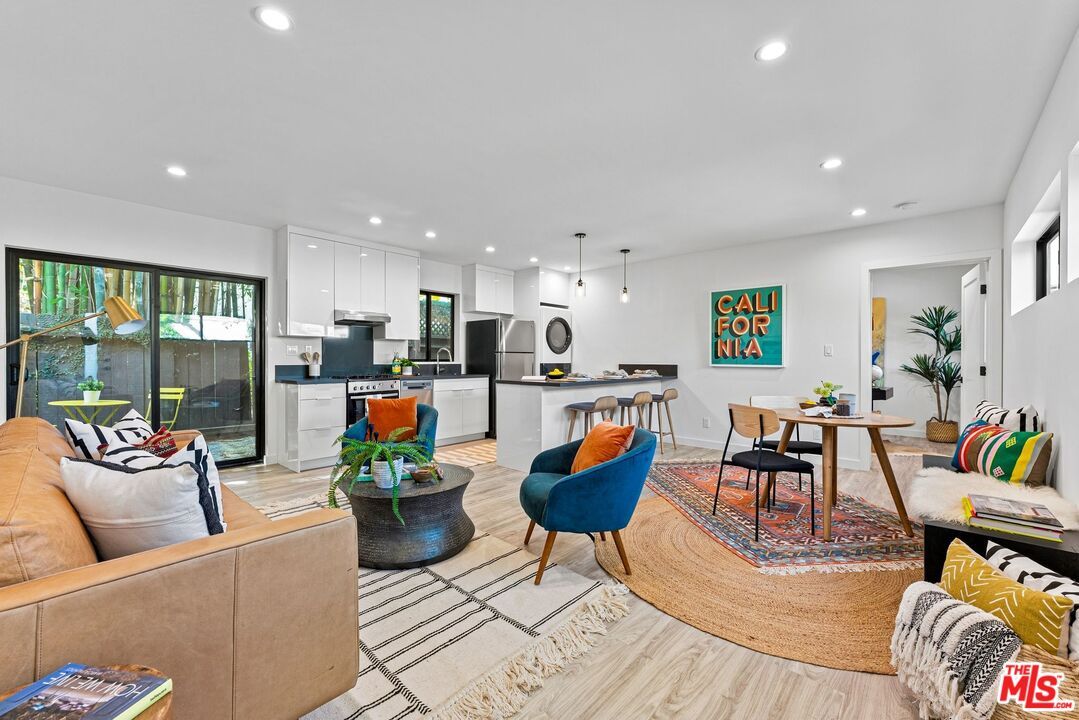 Dining room, Interior, Kitchen, Living room, Pendant Lights, Recessed Lighting, Stainless Steel Appliances, Wood Texture Flooring