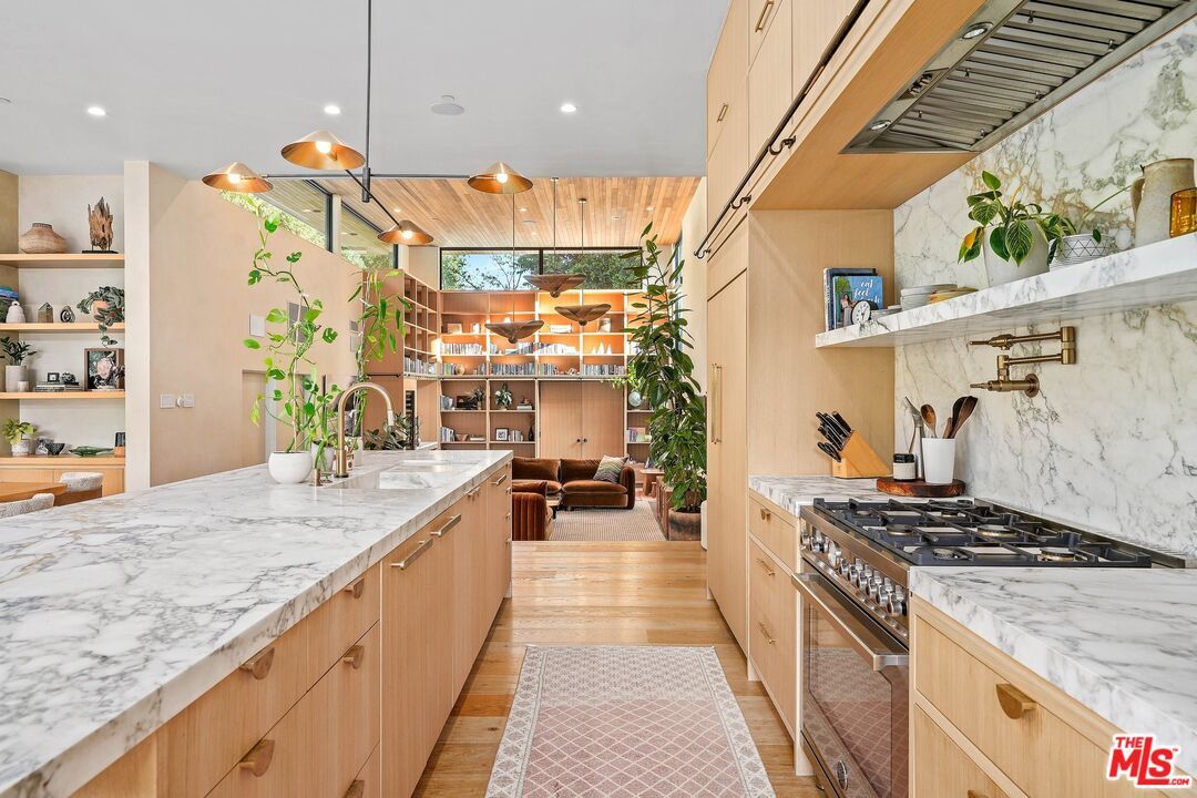 Interior, Kitchen, Marble Walls, Pendant Lights, Recessed Lighting, Stainless Steel Appliances, Wood Texture Flooring