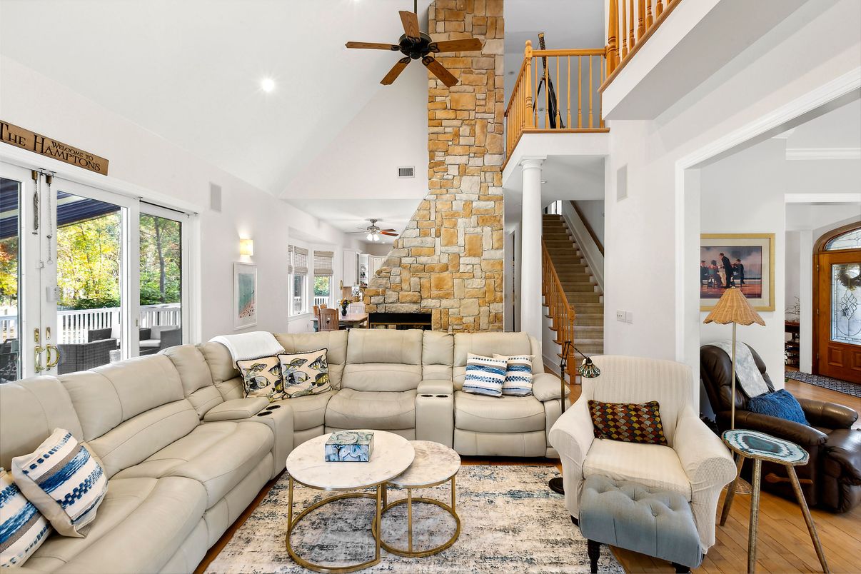 Fireplace, Interior, Living room, Recessed Lighting, Stone Walls, Wood Texture Flooring