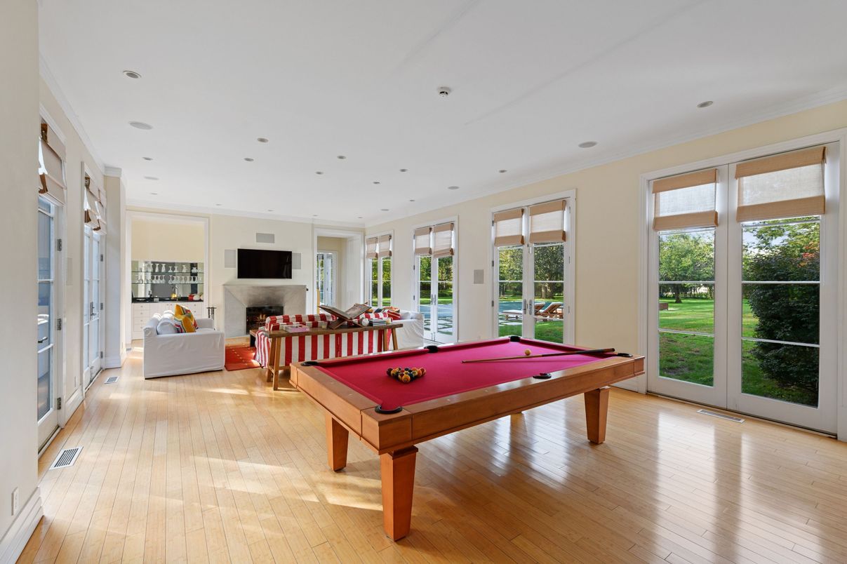 Billiard Table, Fireplace, Game Room, Interior, Living room, Recessed Lighting, Wood Texture Flooring