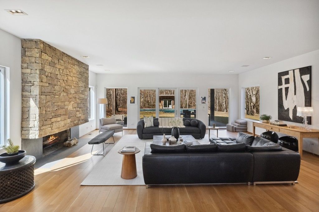 Fireplace, Interior, Living room, Recessed Lighting, Stone Walls, Wood Texture Flooring