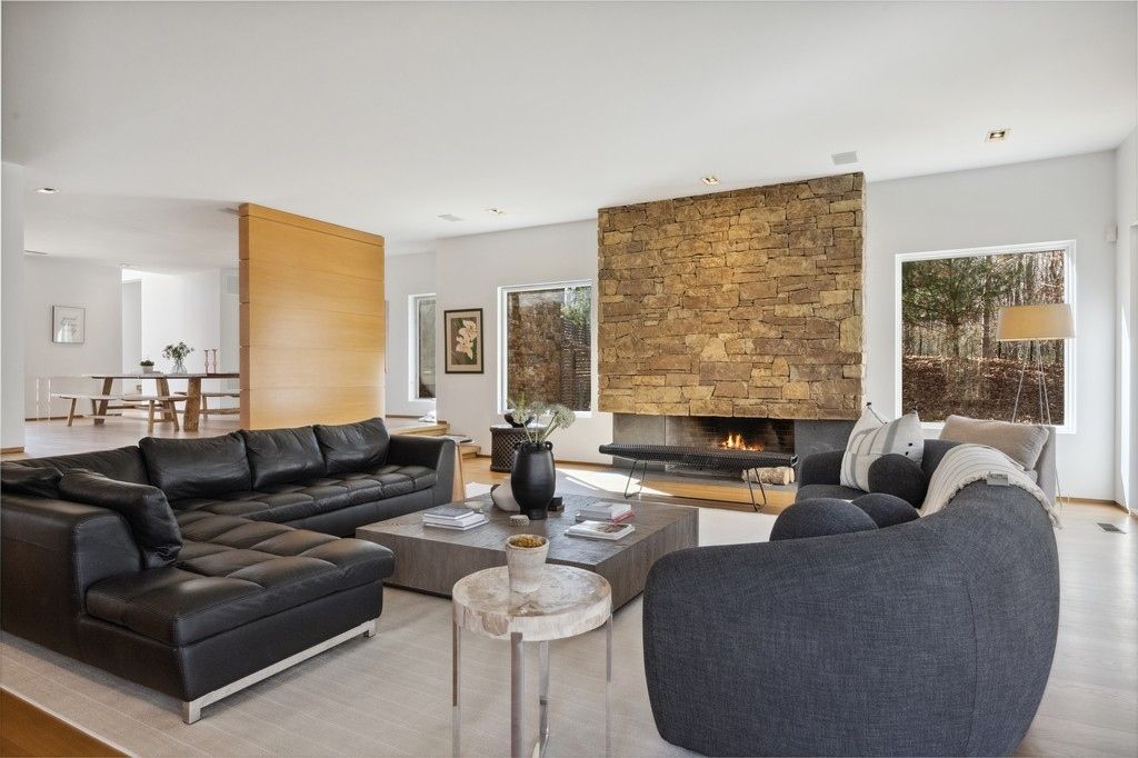 Dining room, Fireplace, Interior, Living room, Recessed Lighting, Stone Walls, Wood Texture Flooring