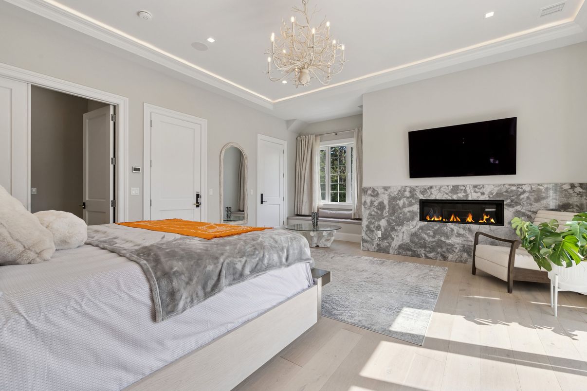 Bedroom, Chandelier, Fireplace, Interior, Recessed Lighting, Wood Texture Flooring