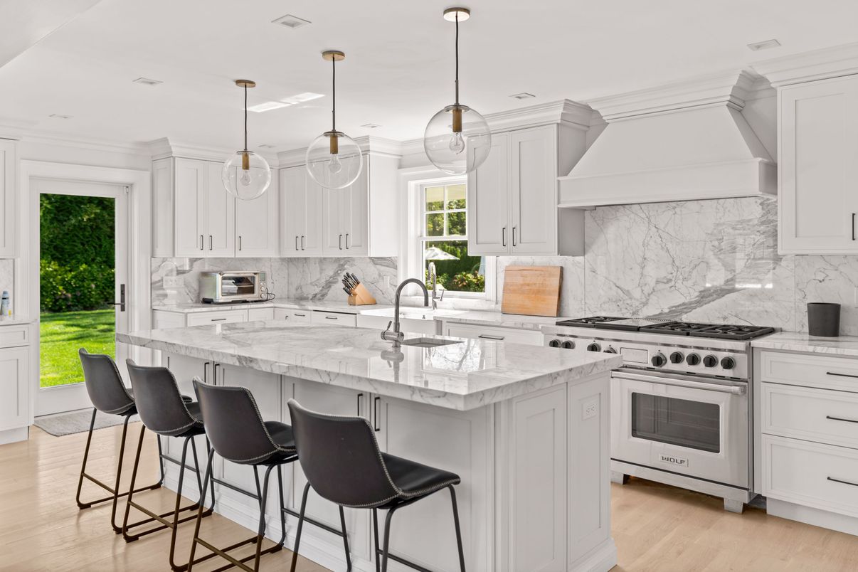 Interior, Kitchen, Marble Walls, Pendant Lights, Recessed Lighting, Stainless Steel Appliances, Wood Texture Flooring