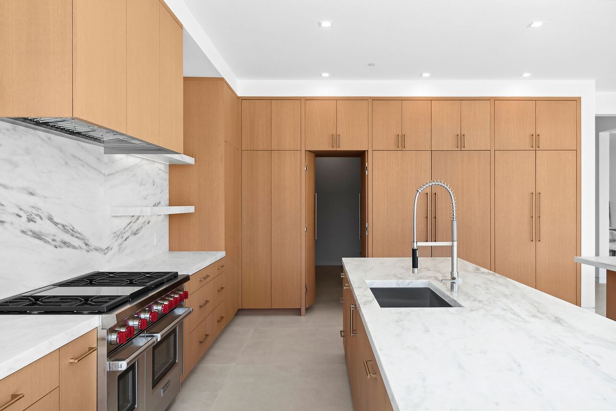 Interior, Kitchen, Marble Walls, Recessed Lighting, Stainless Steel Appliances