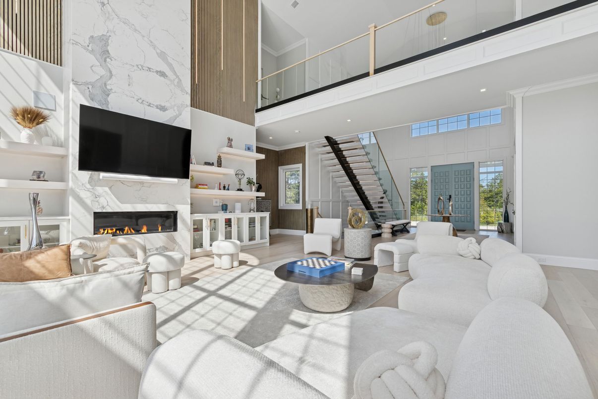 Fireplace, Interior, Living room, Marble Walls, Recessed Lighting, Wood Texture Flooring