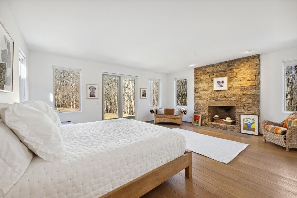 Bedroom, Fireplace, Interior, Recessed Lighting, Stone Walls, Wood Texture Flooring