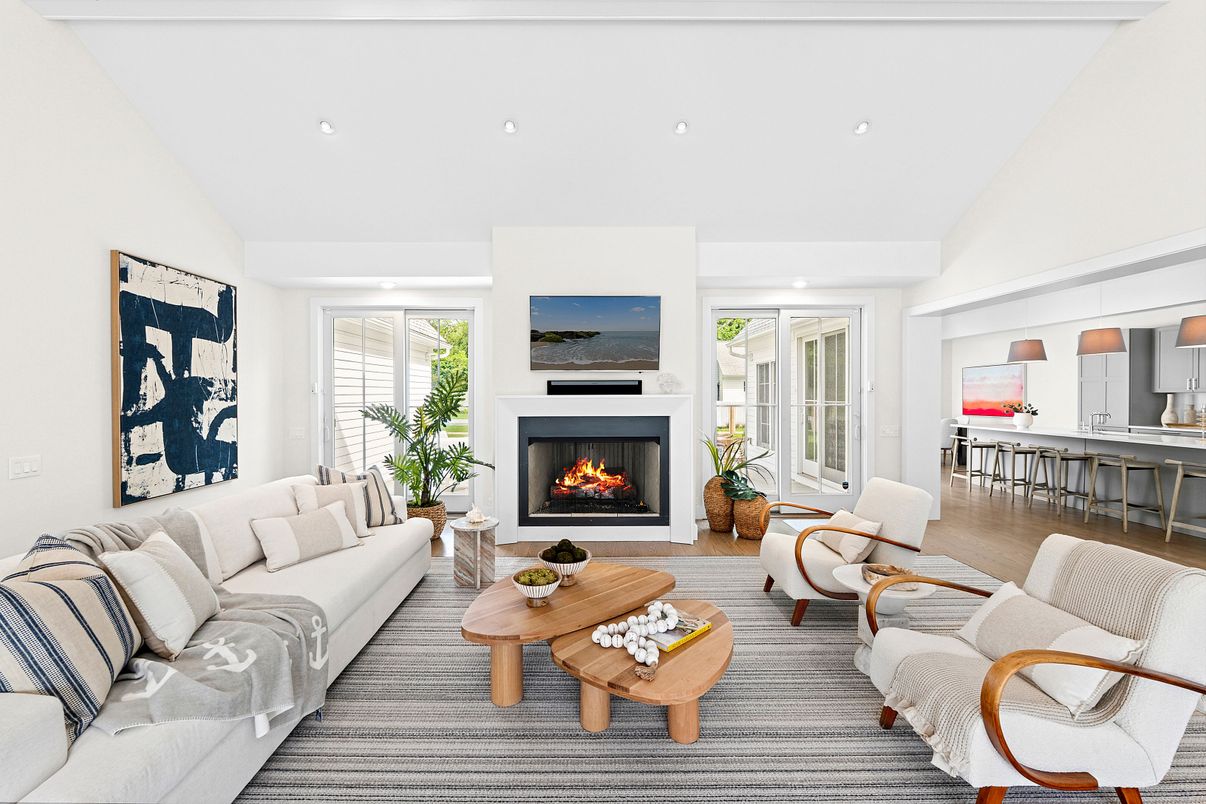 Dining room, Fireplace, Interior, Living room, Recessed Lighting, Wood Texture Flooring