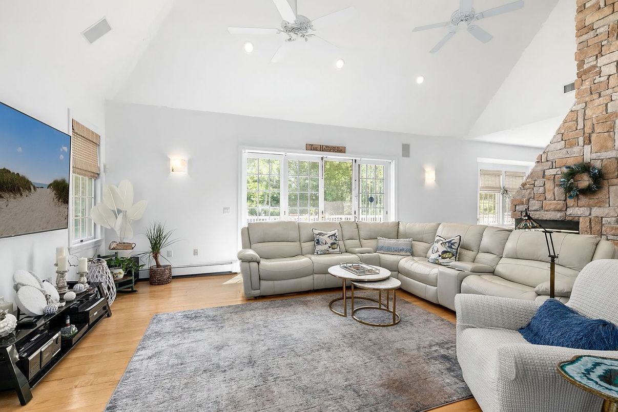 Fireplace, Interior, Living room, Recessed Lighting, Stone Walls, Wood Texture Flooring