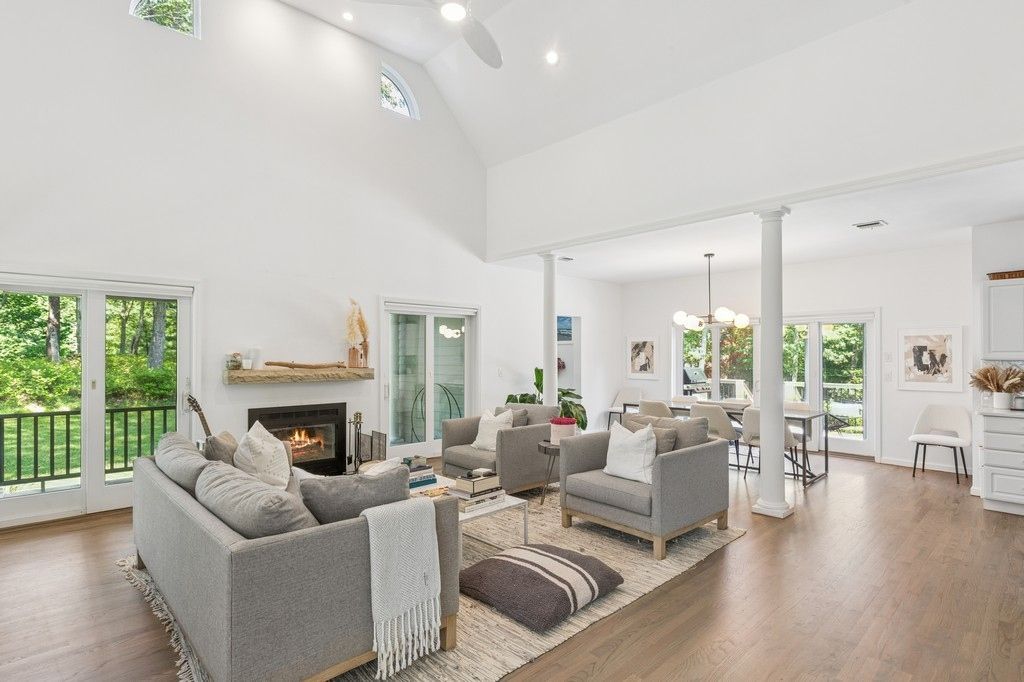 Chandelier, Dining room, Fireplace, Interior, Living room, Pendant Lights, Recessed Lighting, Wood Texture Flooring