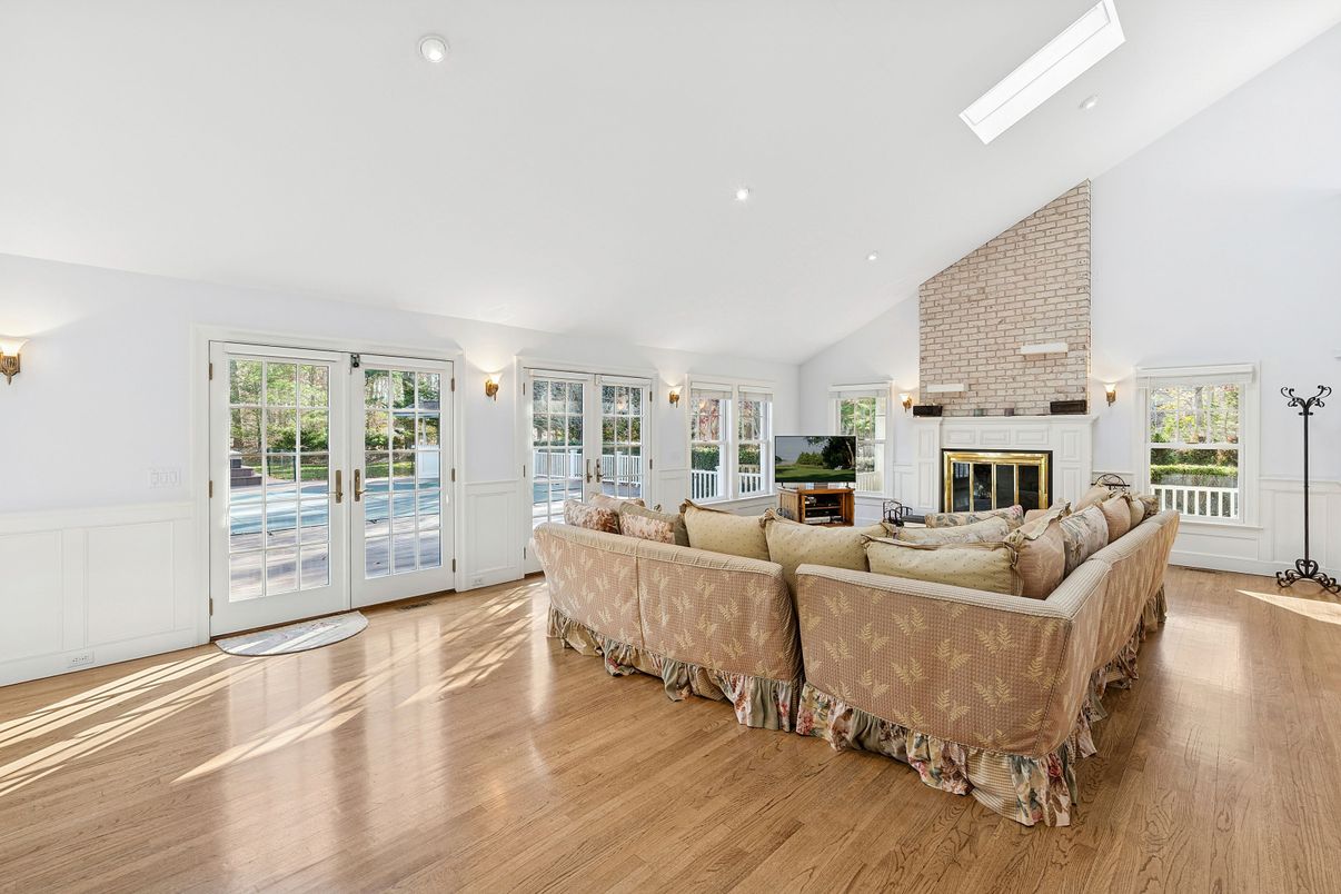 Fireplace, Interior, Living room, Recessed Lighting, Stone Walls, Wood Texture Flooring