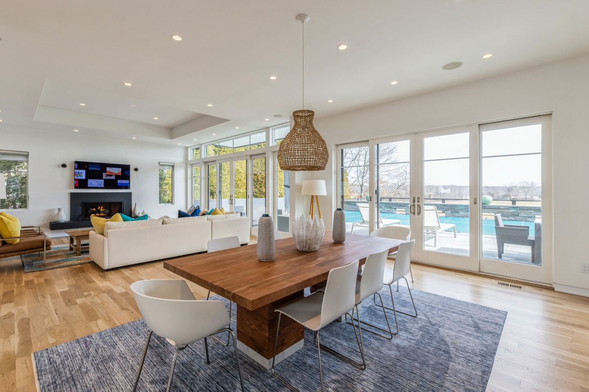 Dining room, Fireplace, Interior, Living room, Pendant Lights, Recessed Lighting, Water, Wood Texture Flooring