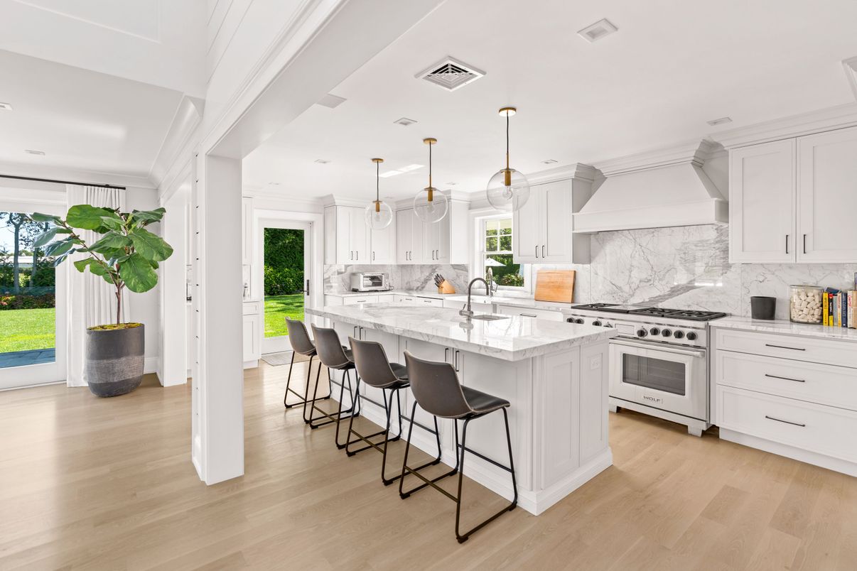 Interior, Kitchen, Marble Walls, Pendant Lights, Recessed Lighting, Stainless Steel Appliances, Wood Texture Flooring