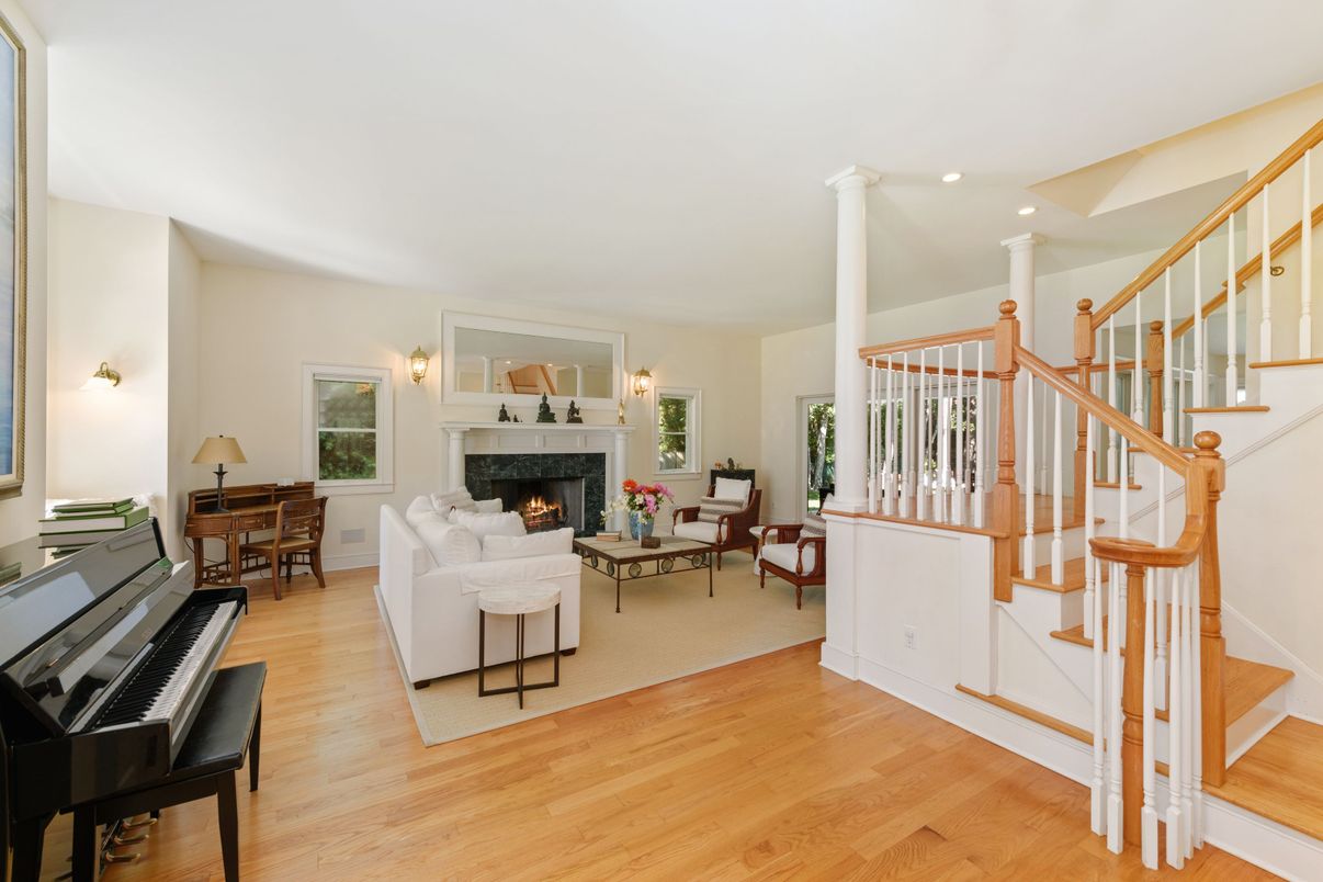 Fireplace, Interior, Living room, Piano, Recessed Lighting, Wood Texture Flooring