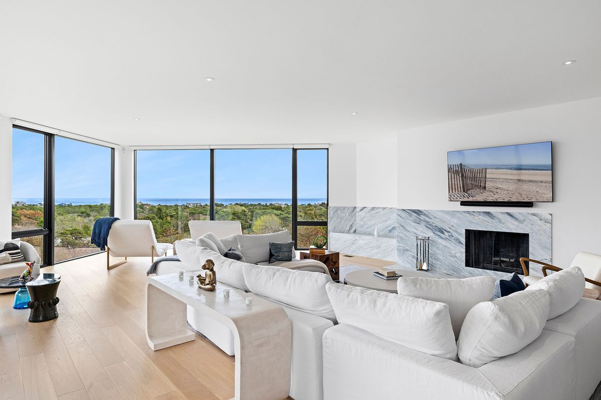 Fireplace, Interior, Living room, Marble Walls, Recessed Lighting, Water, Wood Texture Flooring