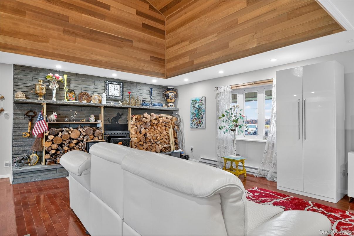 Fireplace, Interior, Living room, Recessed Lighting, Stone Walls, Wooden Ceilings, Wood Texture Flooring