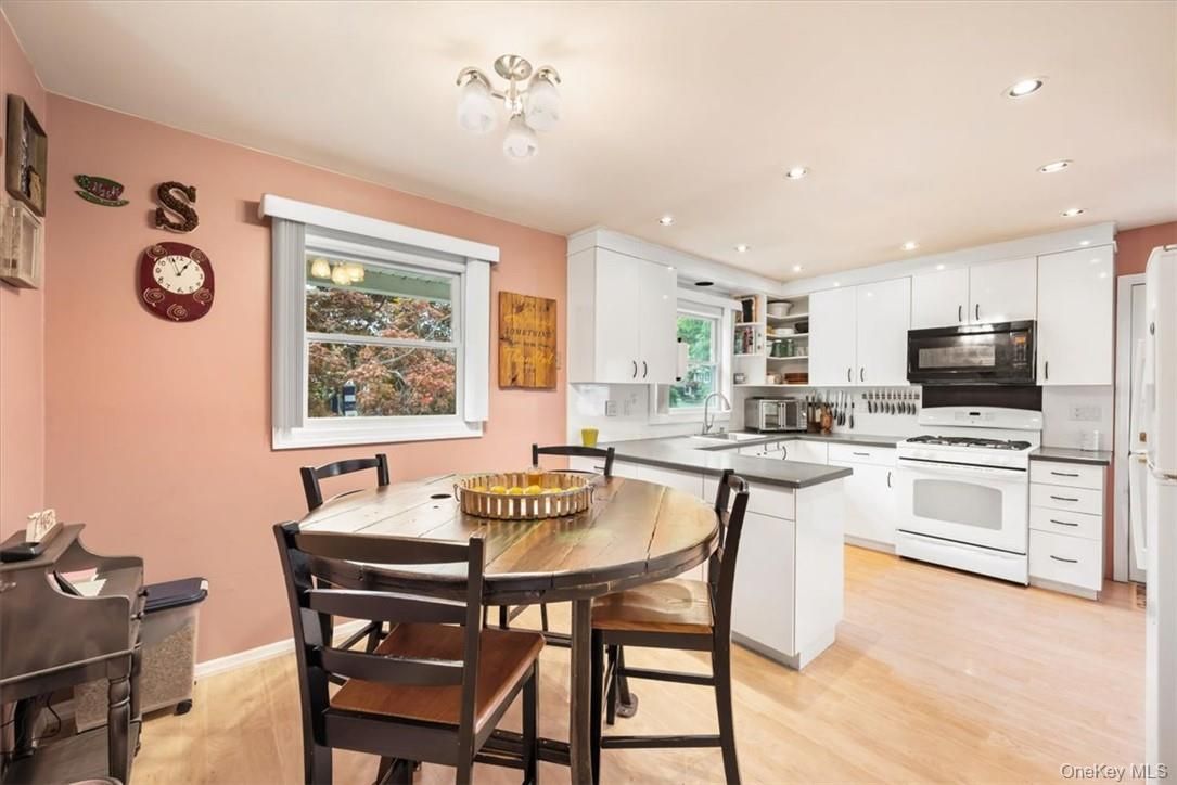Dining room, Interior, Kitchen, Recessed Lighting, Stainless Steel Appliances, Wood Texture Flooring
