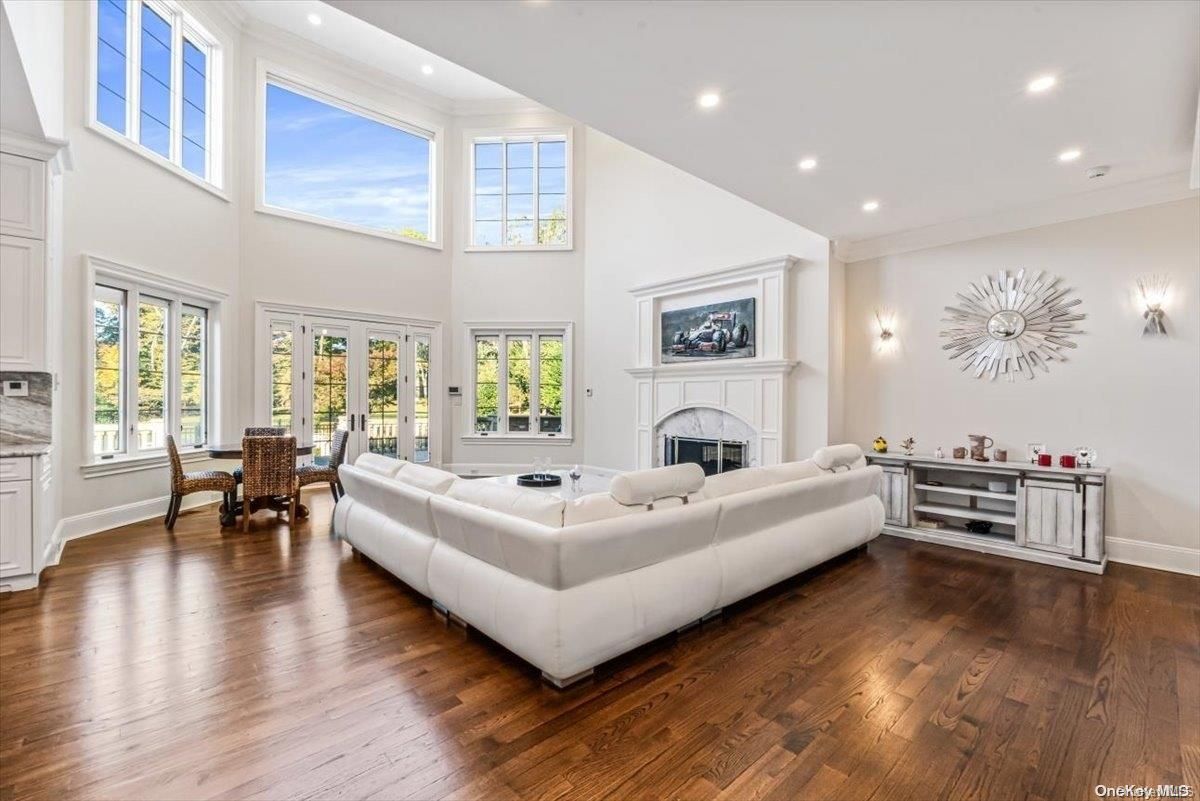Dining room, Fireplace, Interior, Living room, Recessed Lighting, Wood Texture Flooring