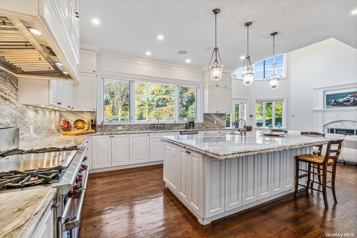 Fireplace, Interior, Kitchen, Pendant Lights, Recessed Lighting, Stainless Steel Appliances, Wood Texture Flooring