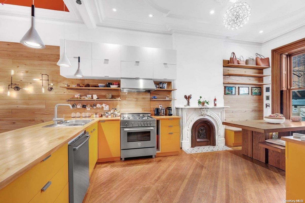 Fireplace, Interior, Kitchen, Pendant Lights, Recessed Lighting, Stainless Steel Appliances, Wood Texture Flooring, Wooden Walls