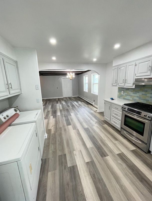 Interior, Kitchen, Recessed Lighting, Washer, Wood Texture Flooring