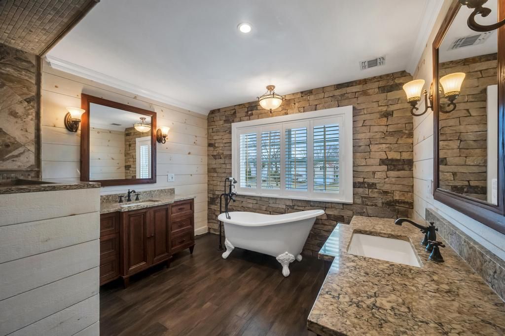 Bathroom, Dual Sink Vanities, Free Standing Baths, Interior, Recessed Lighting, Stone Walls, Wood Texture Flooring