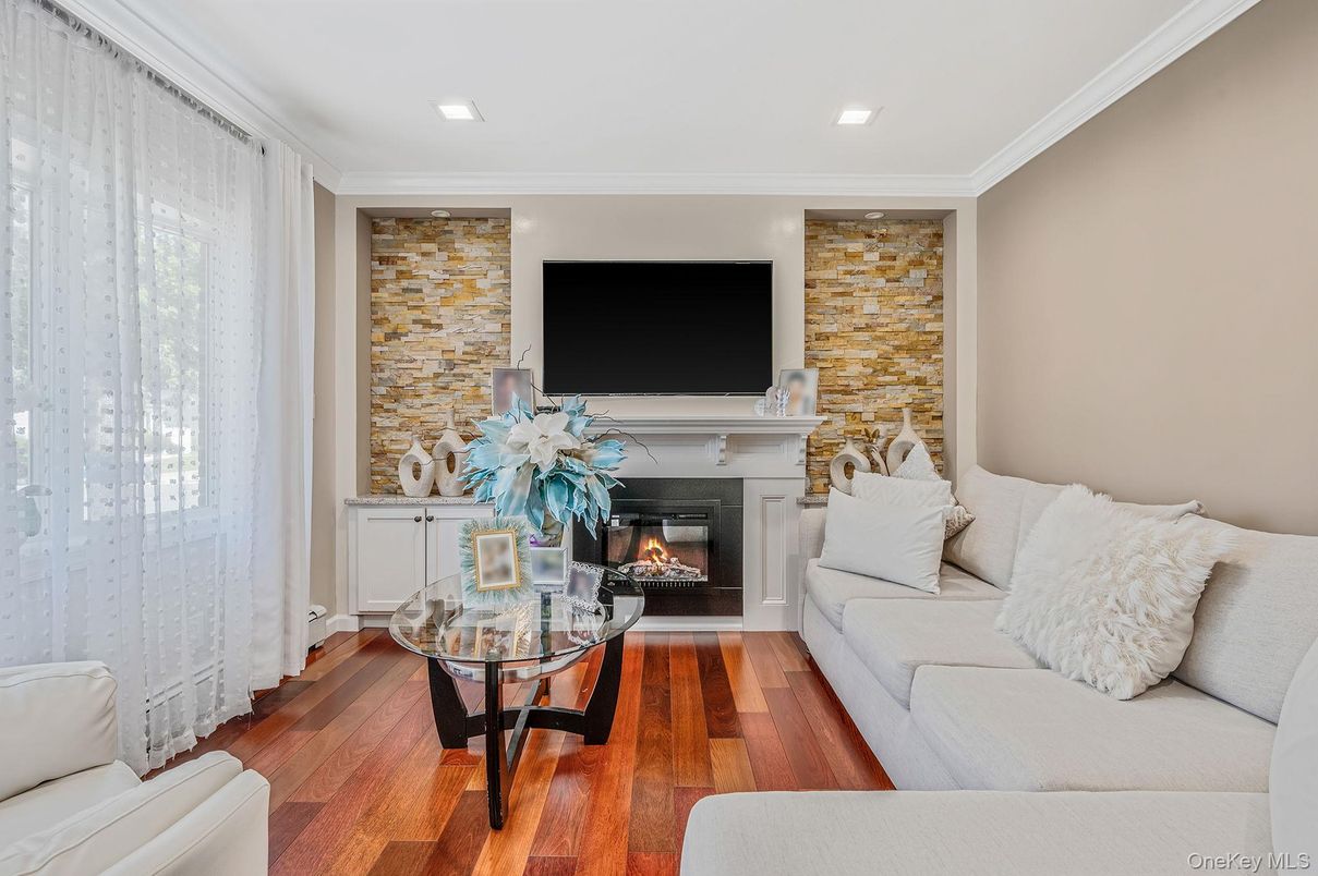 Fireplace, Interior, Living room, Recessed Lighting, Stone Walls, Wood Texture Flooring