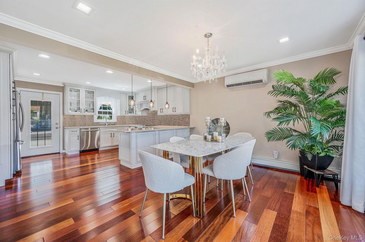 Chandelier, Dining room, Interior, Kitchen, Pendant Lights, Recessed Lighting, Stainless Steel Appliances, Wood Texture Flooring