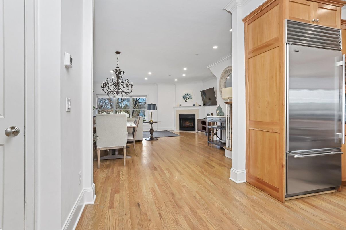 Chandelier, Dining room, Fireplace, Interior, Kitchen, Recessed Lighting, Stainless Steel Appliances, Wood Texture Flooring