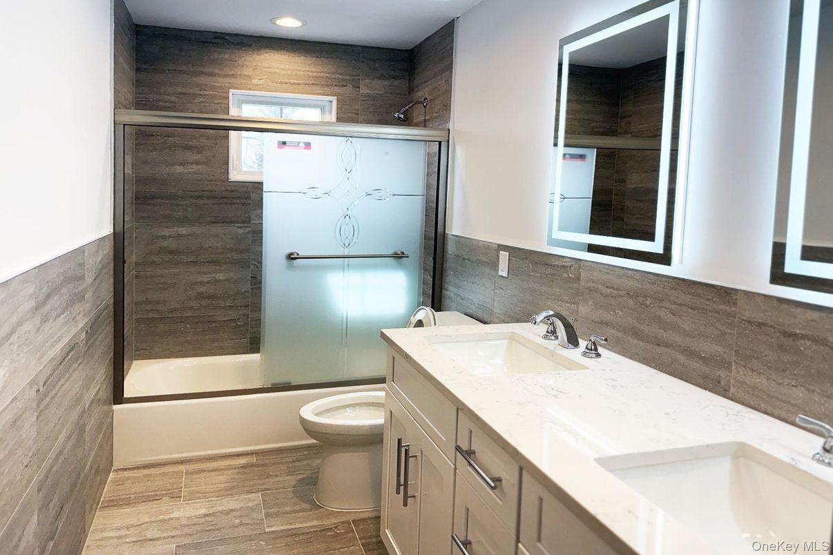 Bathroom, Dual Sink Vanities, Interior, Recessed Lighting, Wood Texture Flooring, Wooden Walls