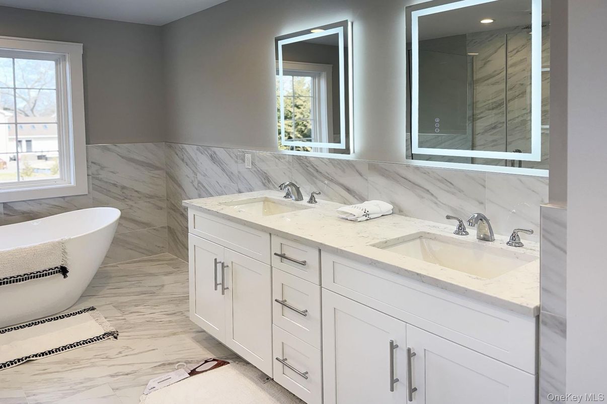 Bathroom, Dual Sink Vanities, Free Standing Baths, Interior, Marble, Marble Walls, Recessed Lighting