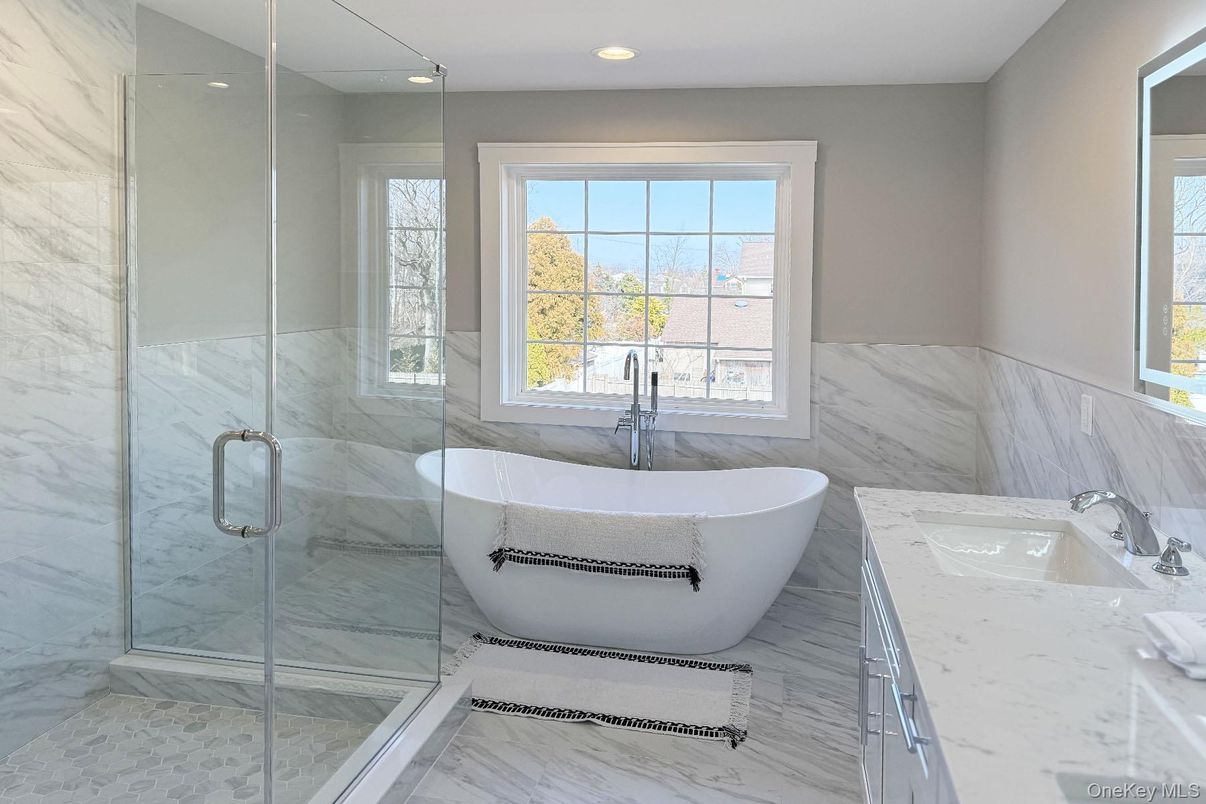 Bathroom, Free Standing Baths, Glass Shower, Interior, Marble, Marble Walls, Recessed Lighting