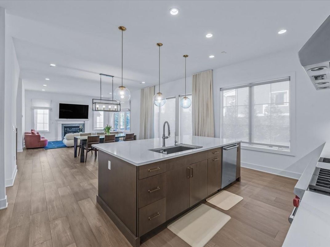 Dining room, Fireplace, Interior, Kitchen, Pendant Lights, Recessed Lighting, Stainless Steel Appliances, Wood Texture Flooring