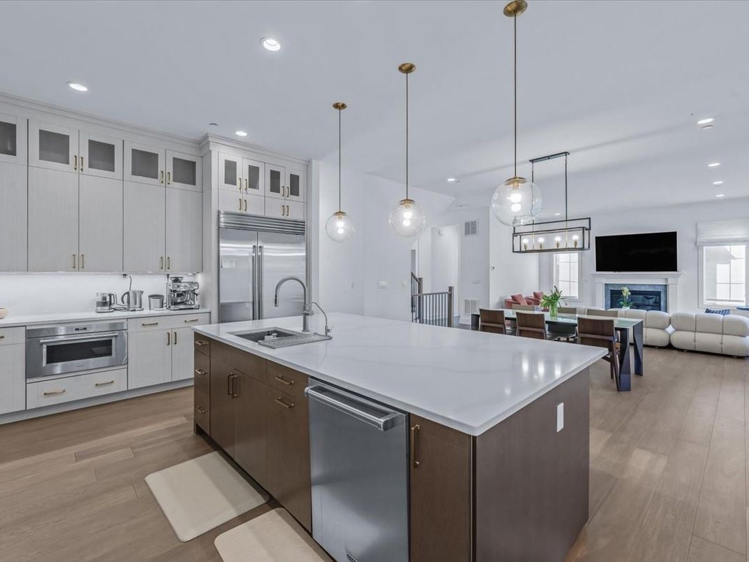 Dining room, Fireplace, Interior, Kitchen, Living room, Pendant Lights, Recessed Lighting, Stainless Steel Appliances, Wood Texture Flooring