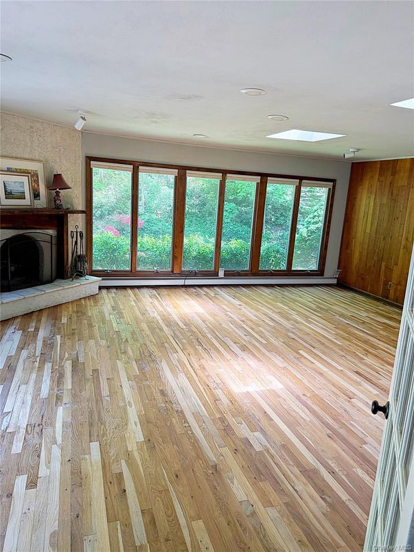 Empty room, Fireplace, Interior, Recessed Lighting, Wood Texture Flooring, Wooden Walls
